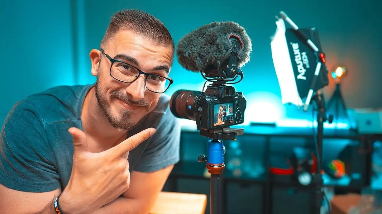 A creator filming a video in front of a camera and soft lighting
